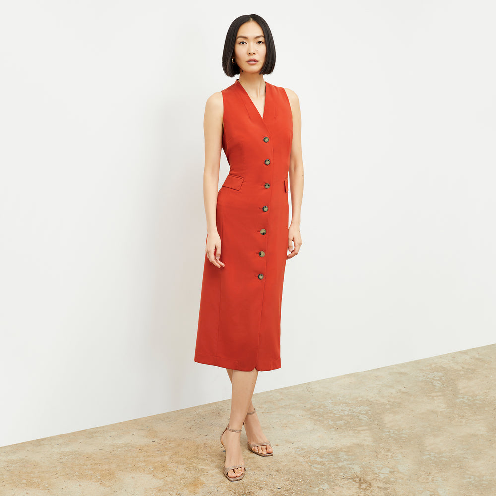 Front image of a woman wearing the Cassandra Dress in Blood Orange