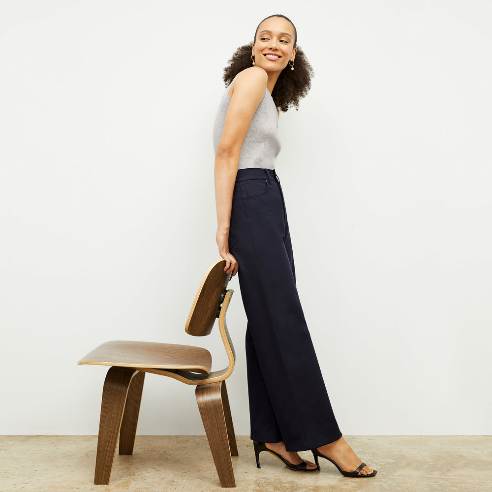 Front image of a woman standing wearing the Milo Jean in ink