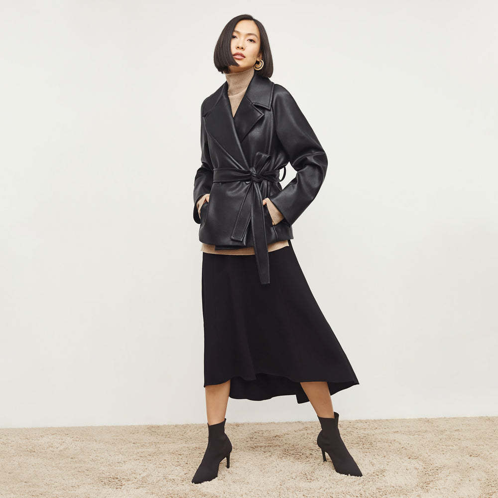 Front image of a woman standing wearing the Alphonso Jacket—Vegan Leather in Black