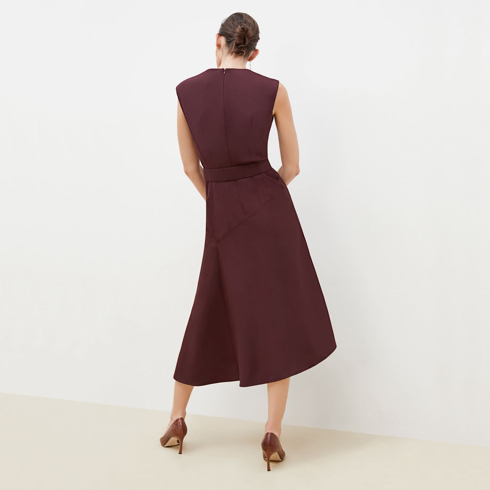 Back image of a woman standing wearing the Kelsey Dress-Sharkskin in garnet
