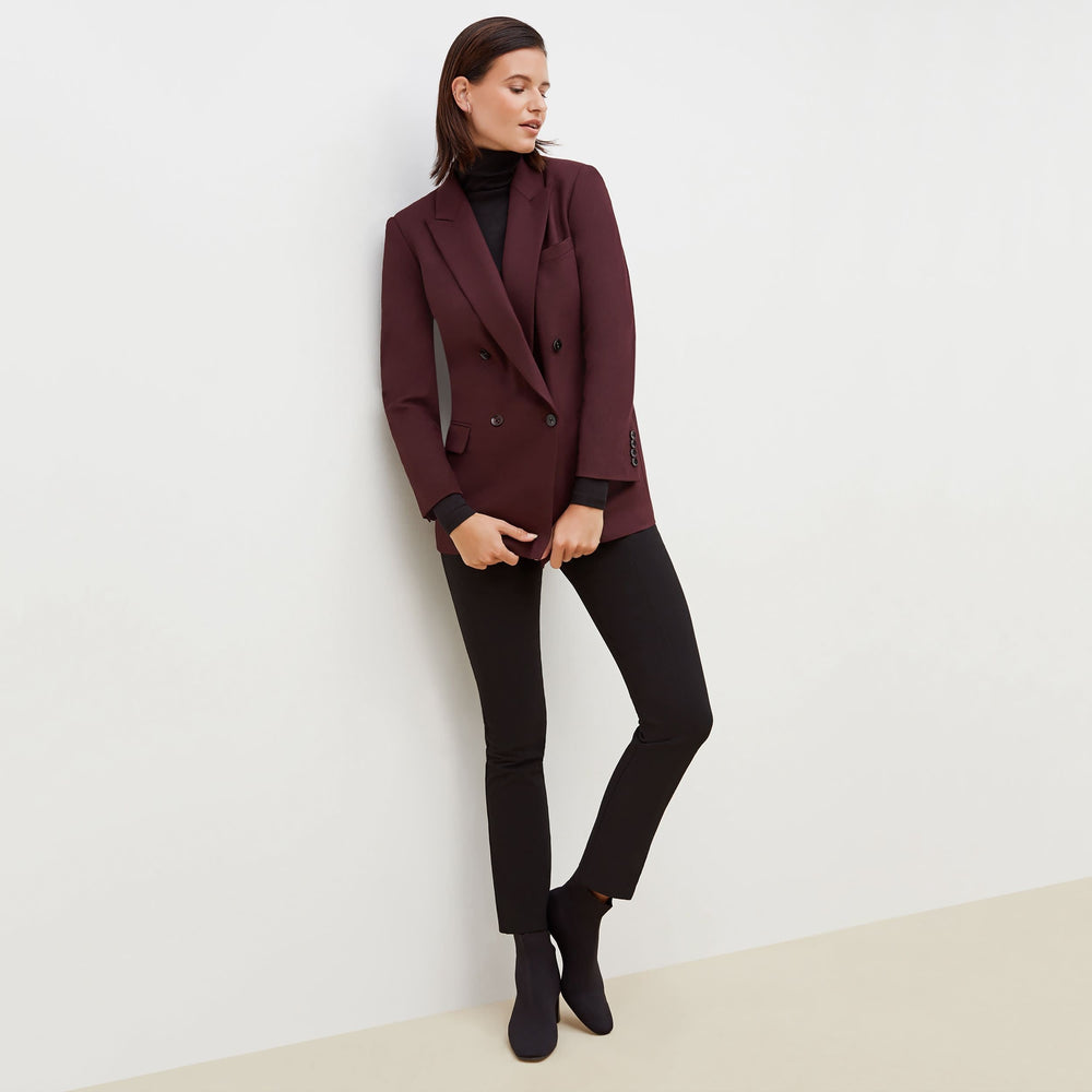 Front image of a woman standing wearing the O'Hara Blazer-Sharkskin in garnet