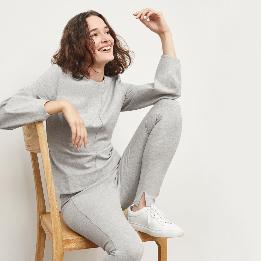 Front image of a woman standing wearing the Rashida Top in Gray Melange