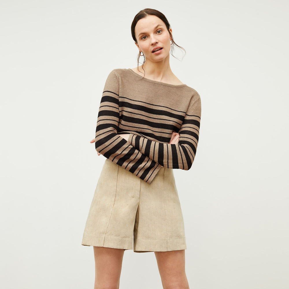 Front image of a woman standing wearing the Samara Sweater—Knit Linen in Oak / Black