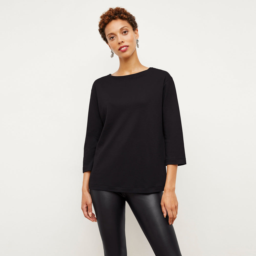 Front image of a woman wearing the Owen T-Shirt in Black