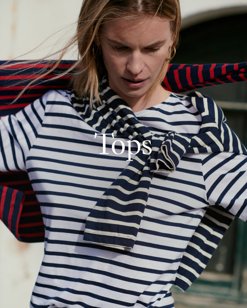Woman wearing a striped shirt with a scarf, with 'Tops' text overlay.