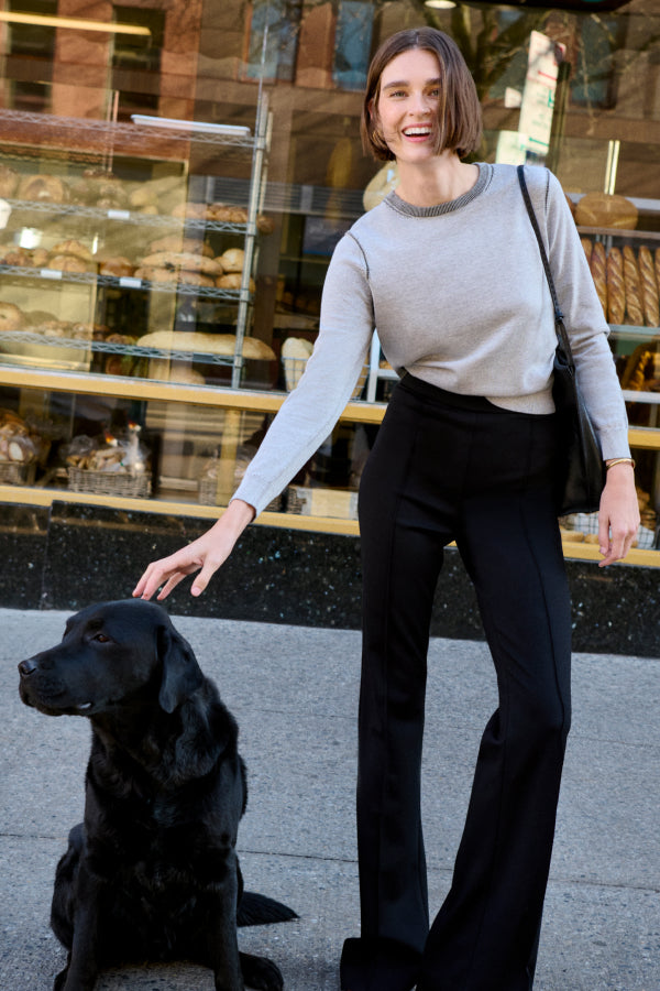 image of a woman petting a dog