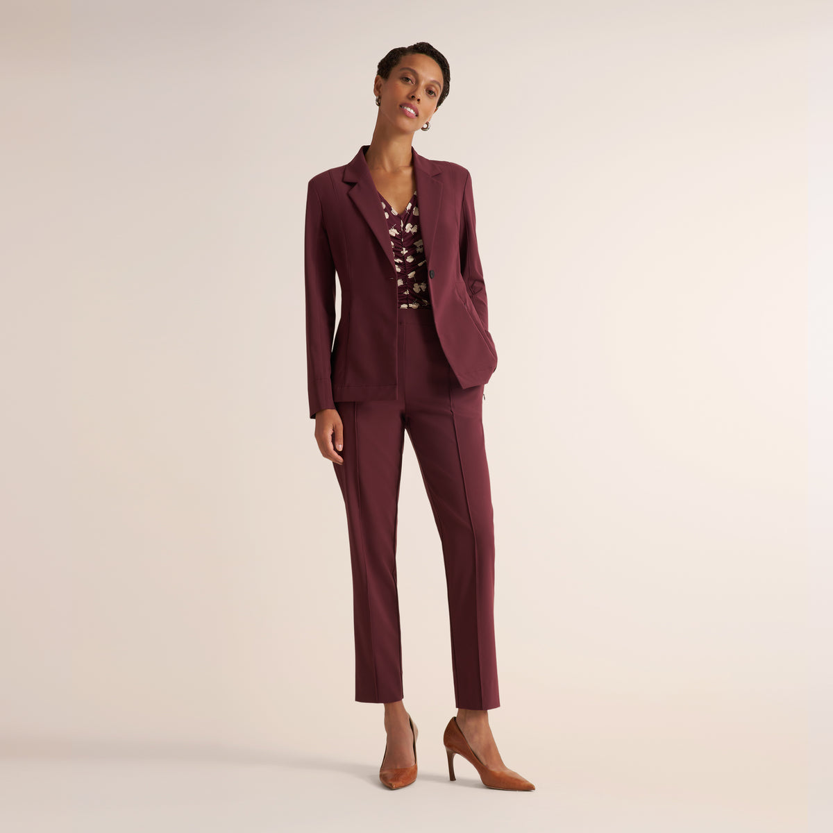 Woman wearing the Moreland Travel Blazer in Aubergine