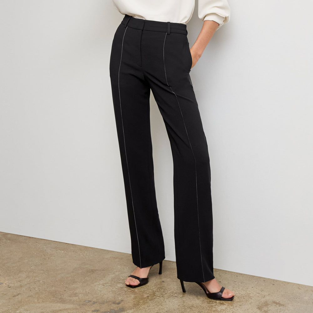 front image of a woman wearing the lowen pant in black with topstitch