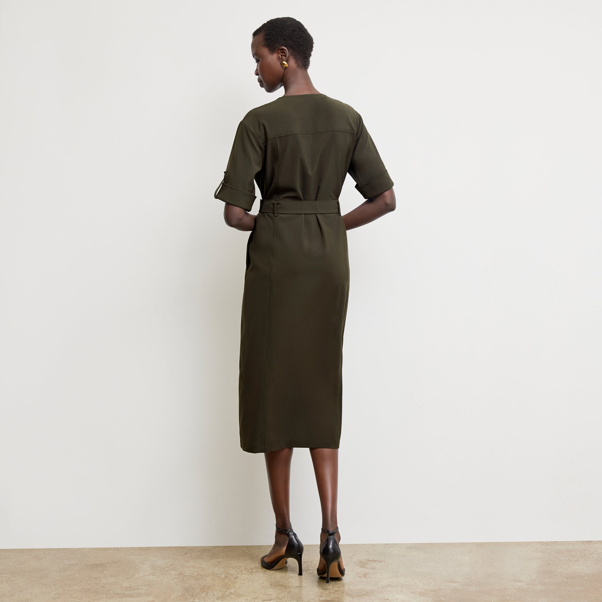 Back image of a woman wearing the Artemis Dress in Olive 