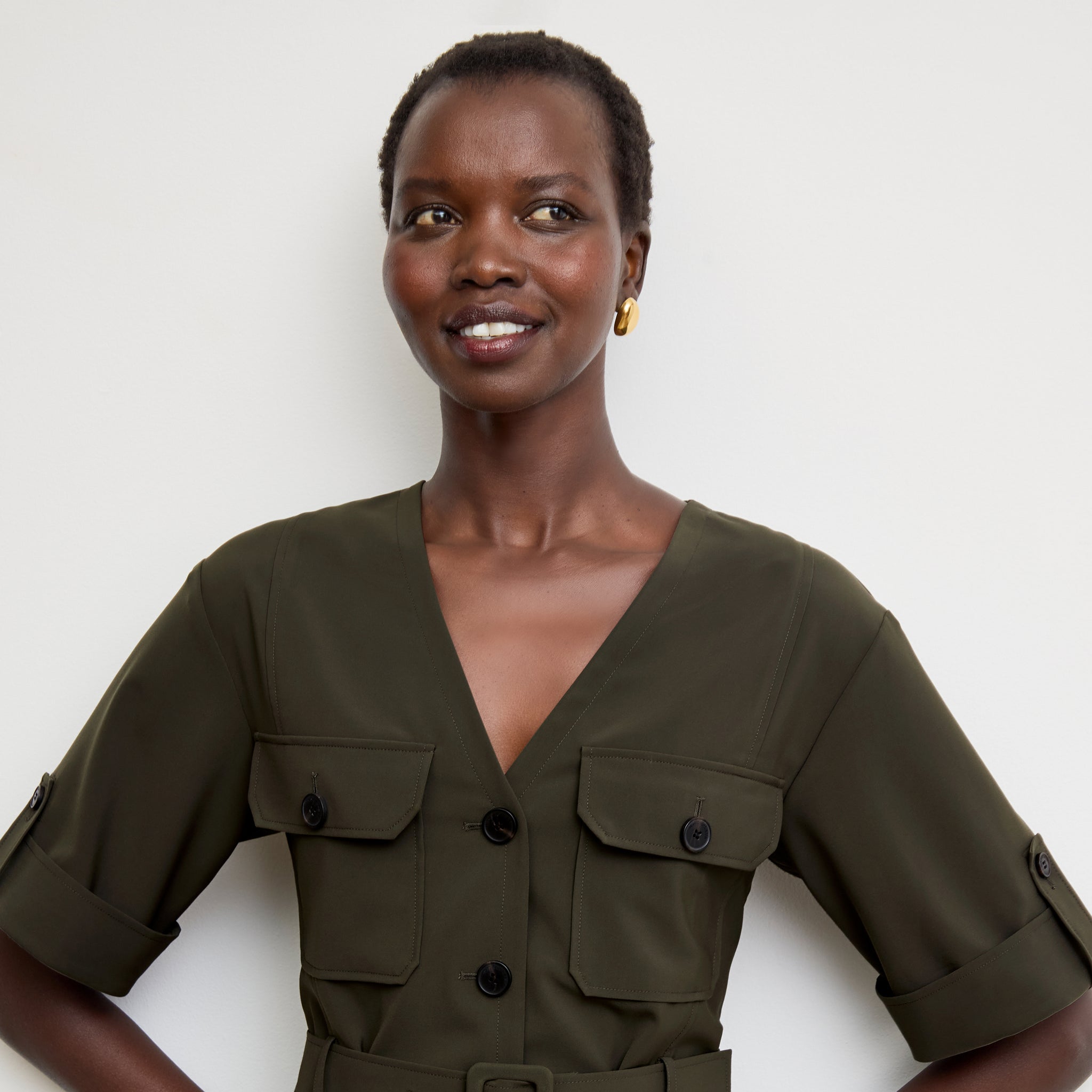 Front image of a woman wearing the Artemis Dress in Olive 