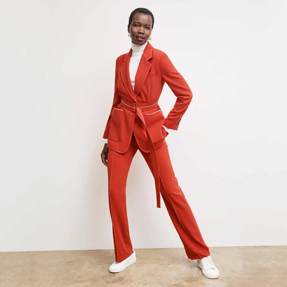 front image of a woman wearing the lowen pant in ginger with topstitch