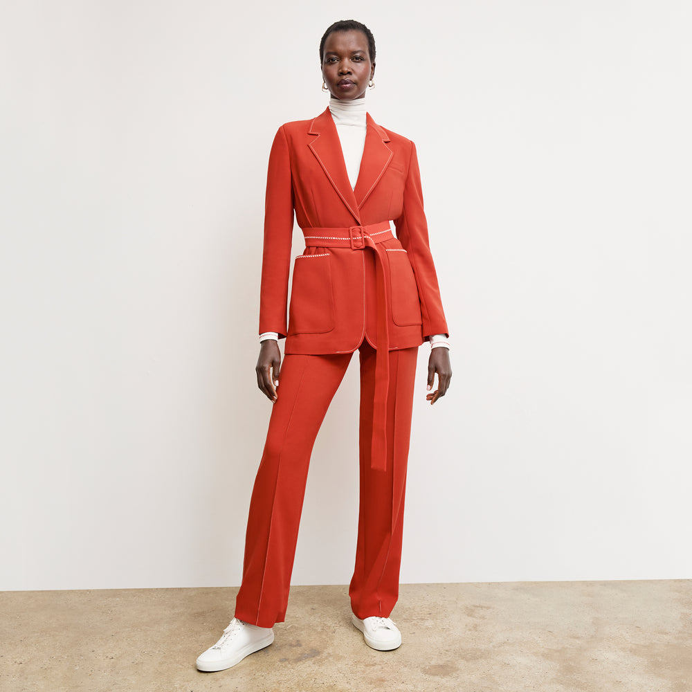 front image of a woman wearing the lowen pant in ginger with topstitch