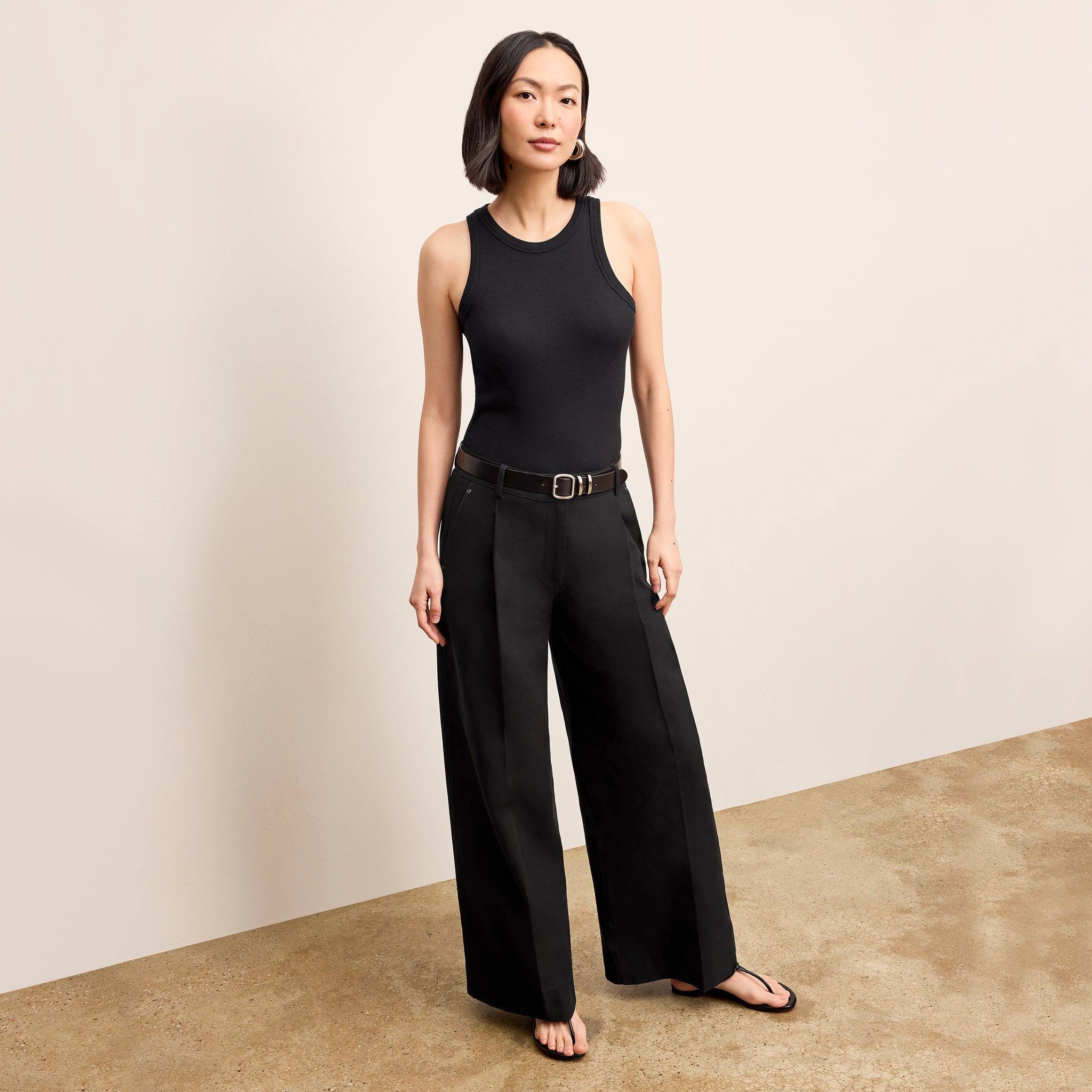 Front image of a woman wearing the Harrison Pant in Black