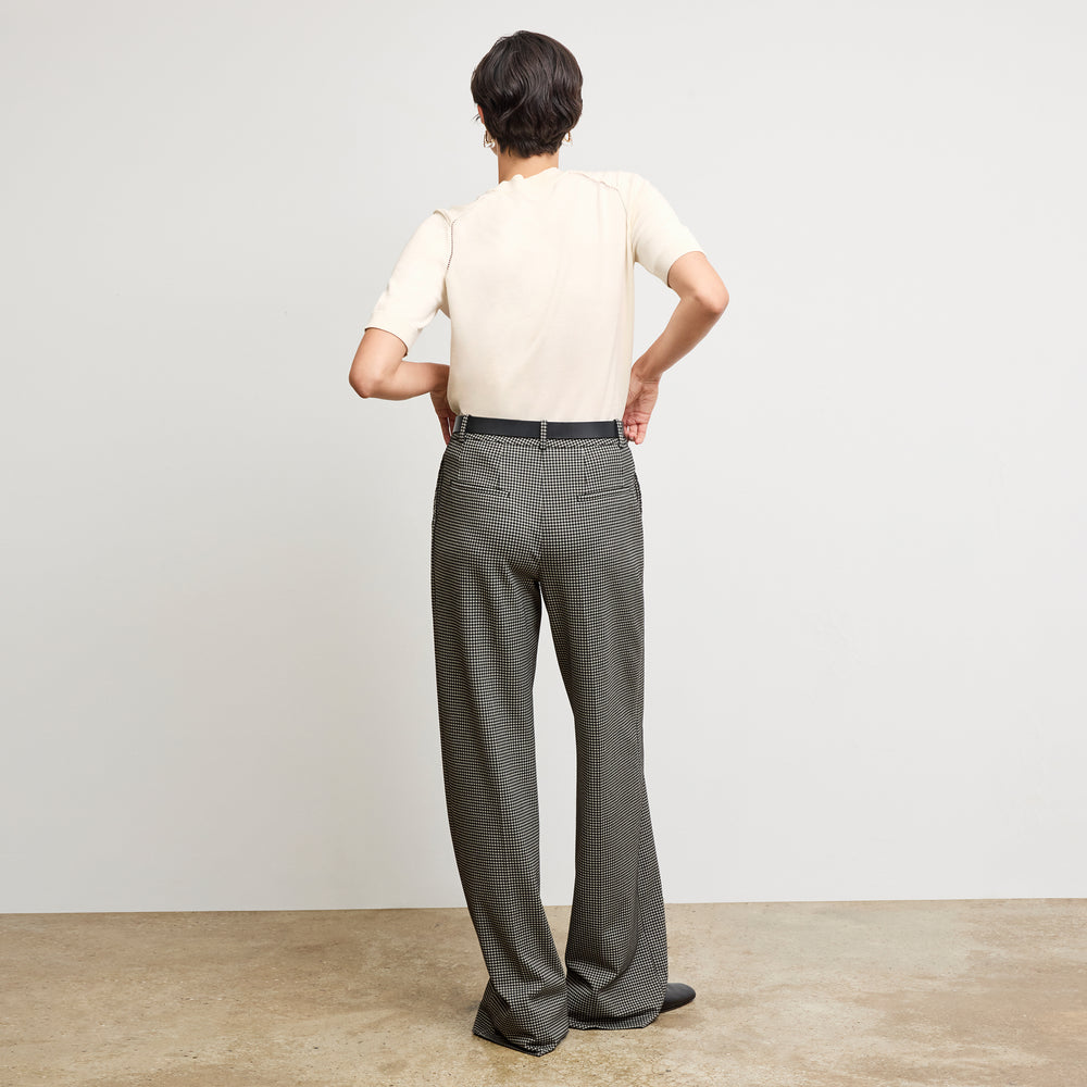 back image of a woman wearing the becca top in ivory