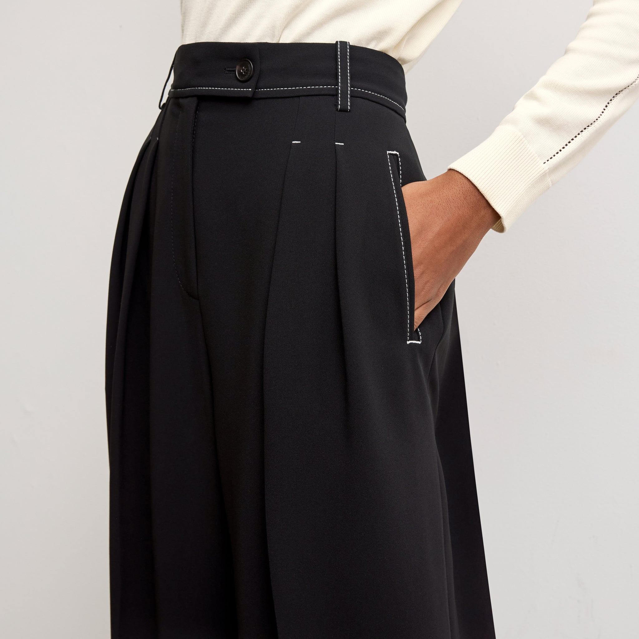 detail image of a woman wearing the bia pants in black with topstitch 