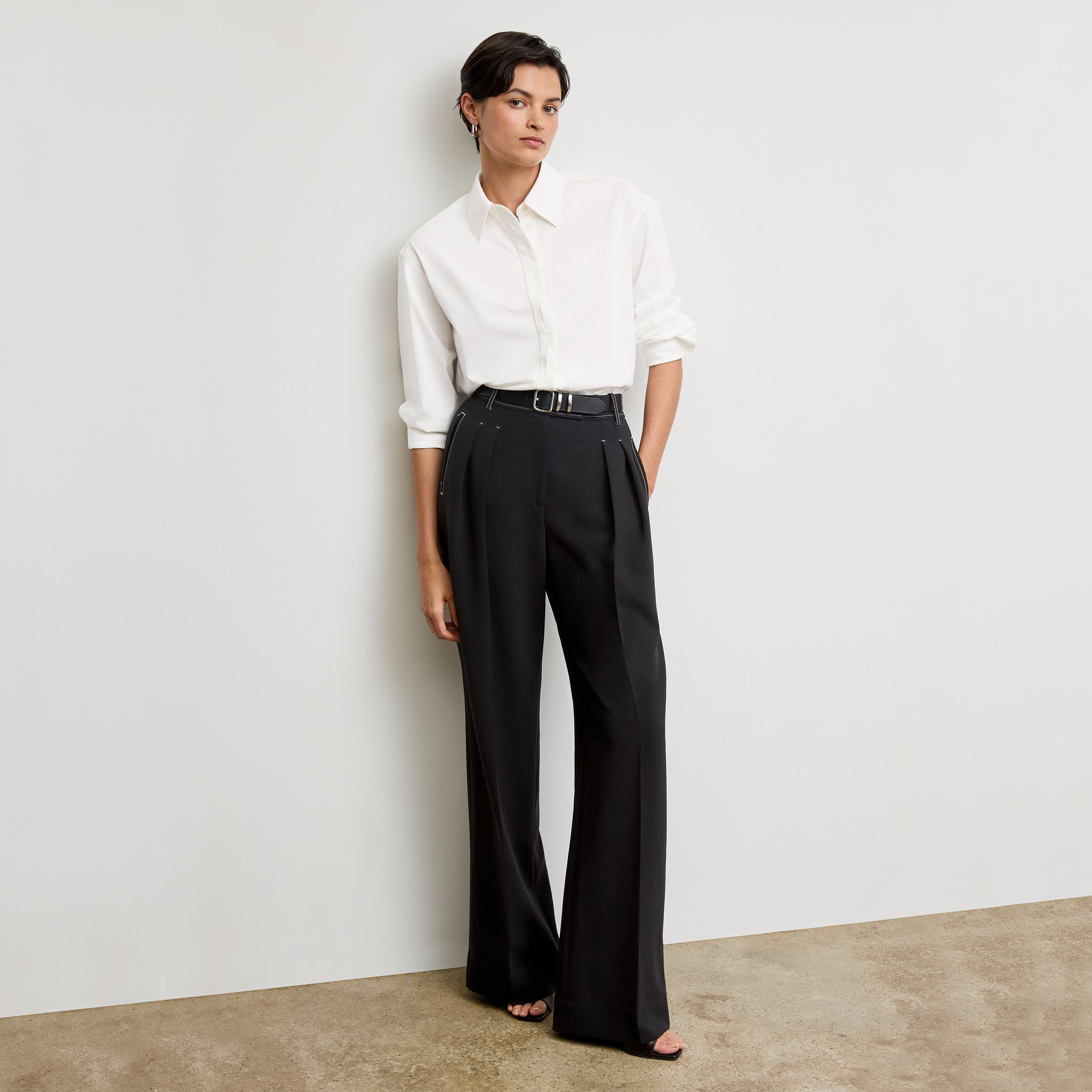 front image of a woman wearing the bia pants in black with topstitch 