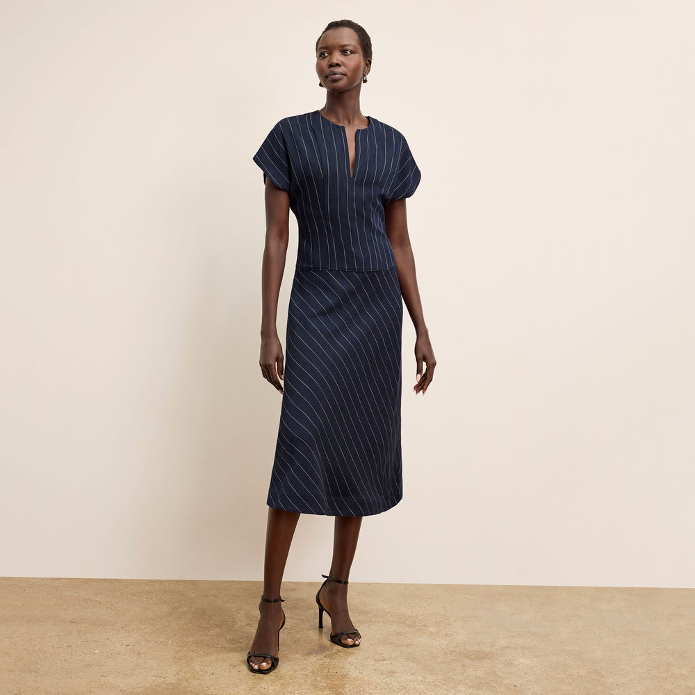 Front image of a woman wearing the Cereah Dress in Porto Weave