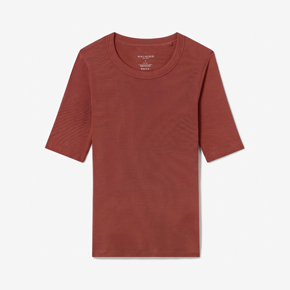 A rust-colored short-sleeve crewneck t-shirt with a subtle horizontal ribbed texture, displayed flat against a light gray background.
