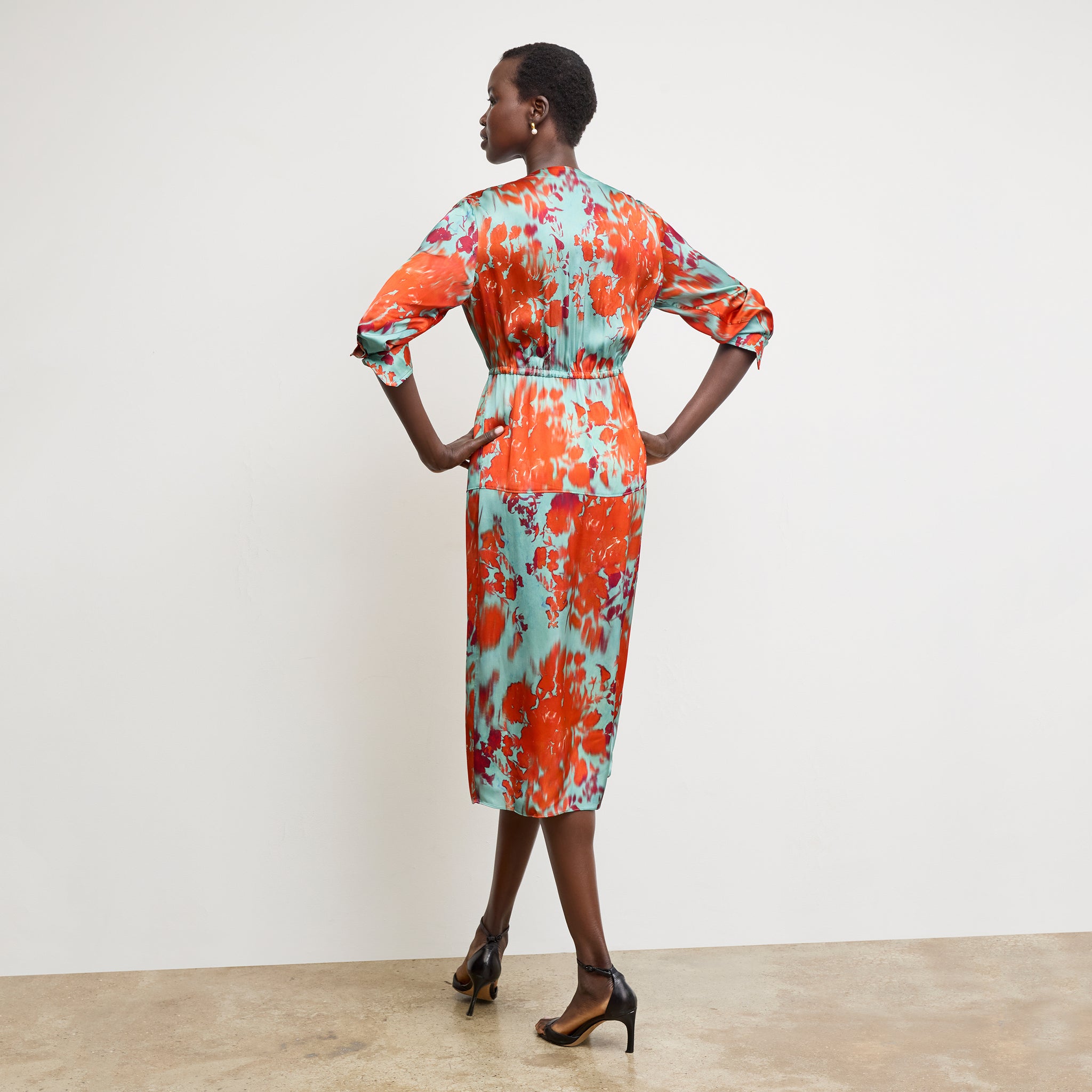Back image of a woman wearing the Deana Dress in Ombre Floral Printed Viscose