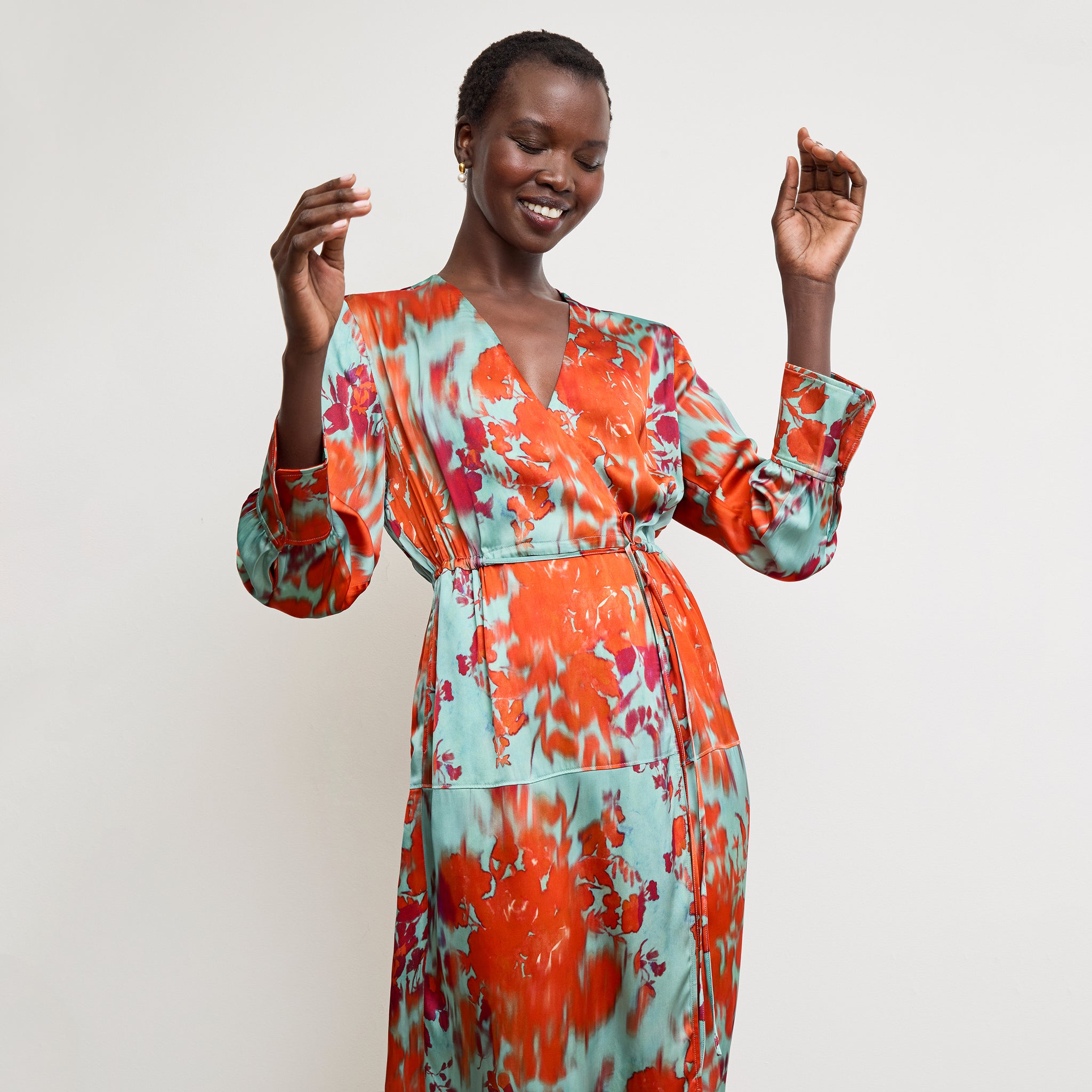 Front image of a woman wearing the Deana Dress in Ombre Floral Printed Viscose