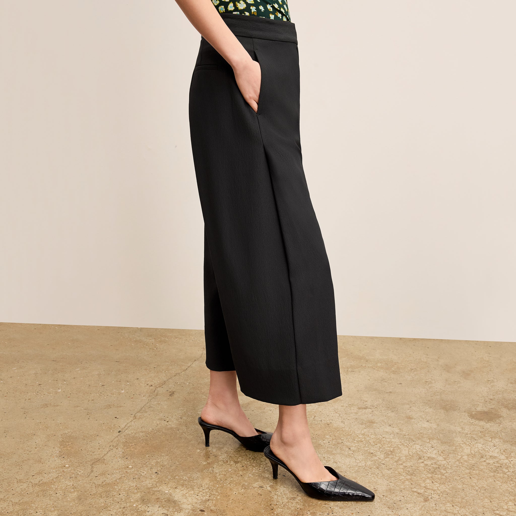 Side image of a woman wearing the Zhou Culotte - Eco Soft Wave :: Black