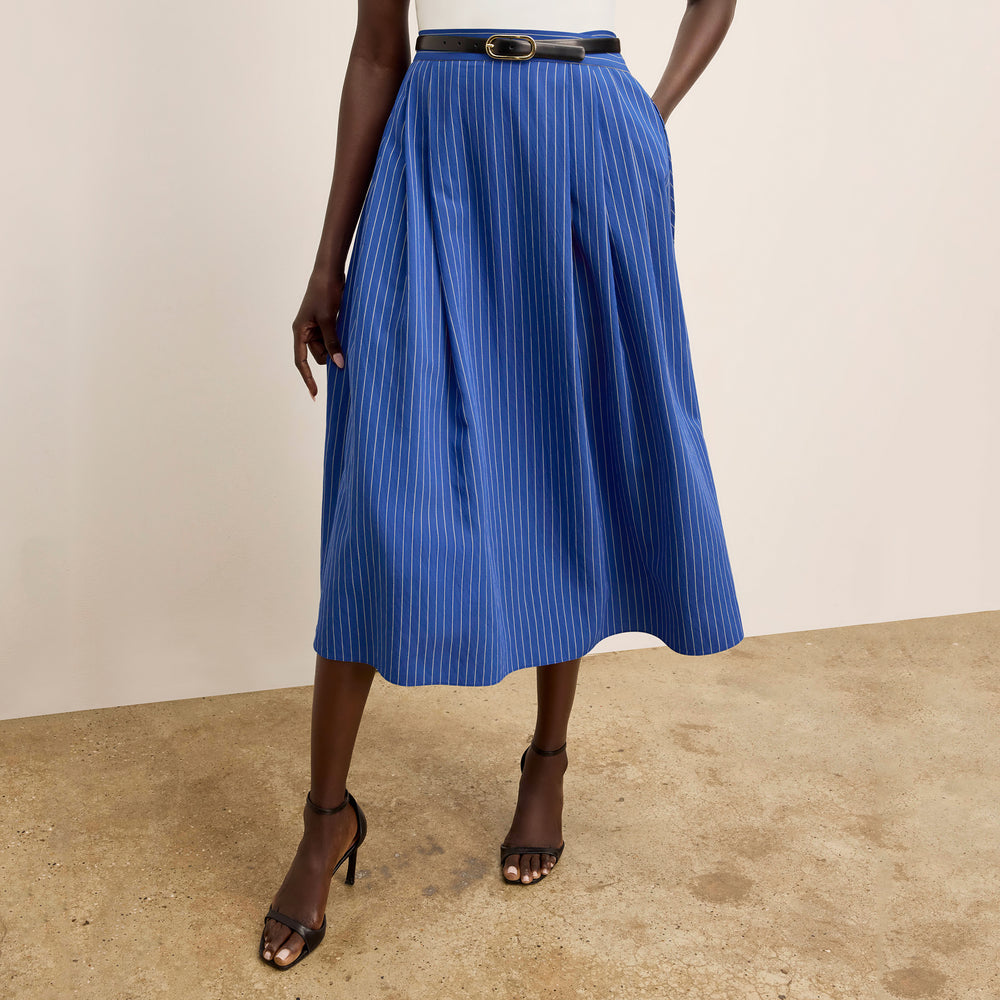front image of a woman wearing the easton skirt in soft stripe