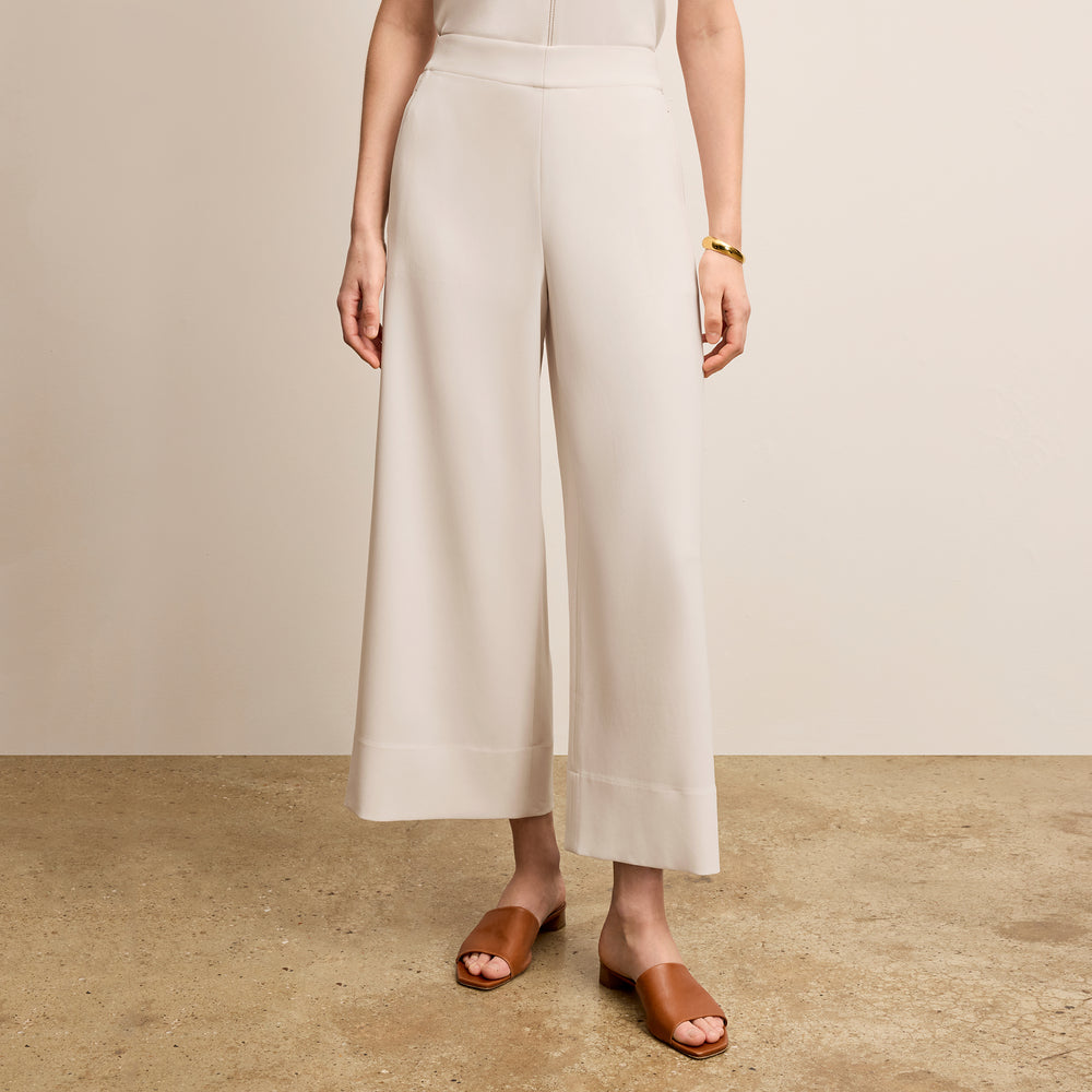 front image of a woman wearing the elena pant in eggshell