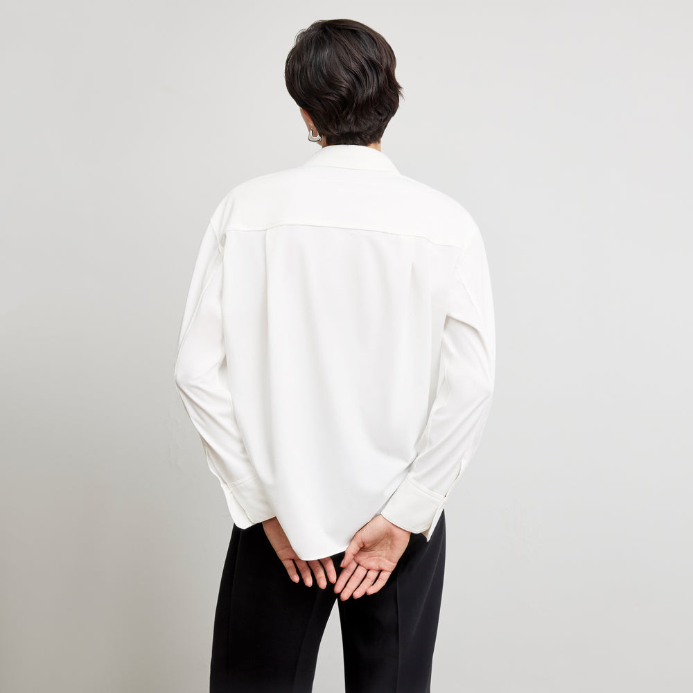 back image of a woman wearing the filomina top in white