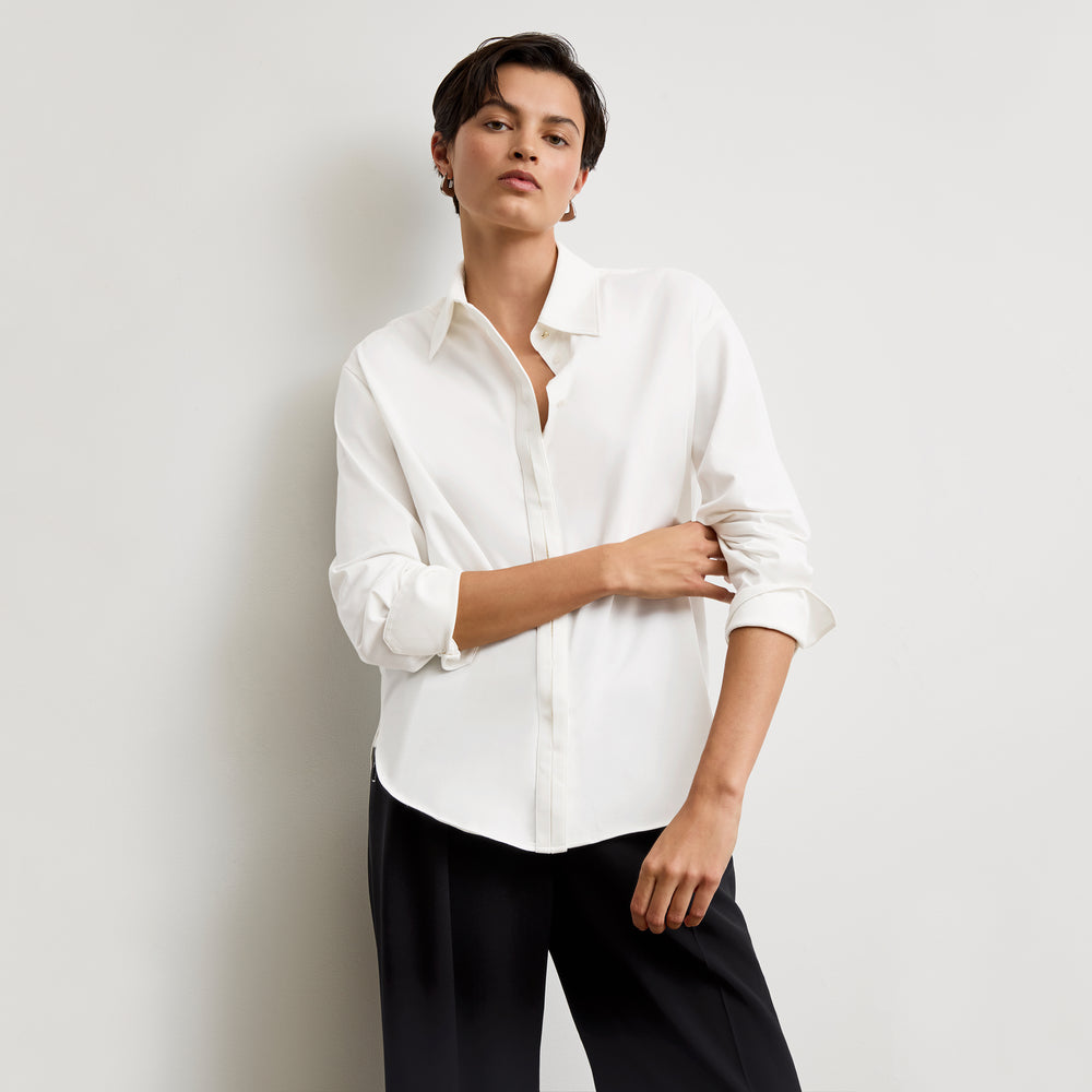 front image of a woman wearing the filomina top in white