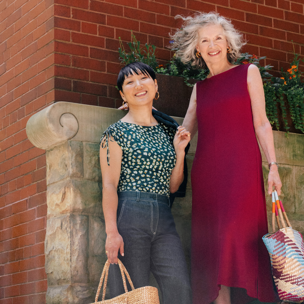 Two women standing with one of them Wearing Bari Barrel-Leg Jean - Stretch Denim :: Midnight Wash