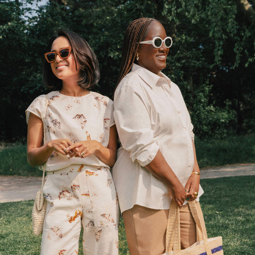 Two women standing outdoors one of them wearing The Madelyn Pull-On Pant - Airy Cotton :: Butterfly Print