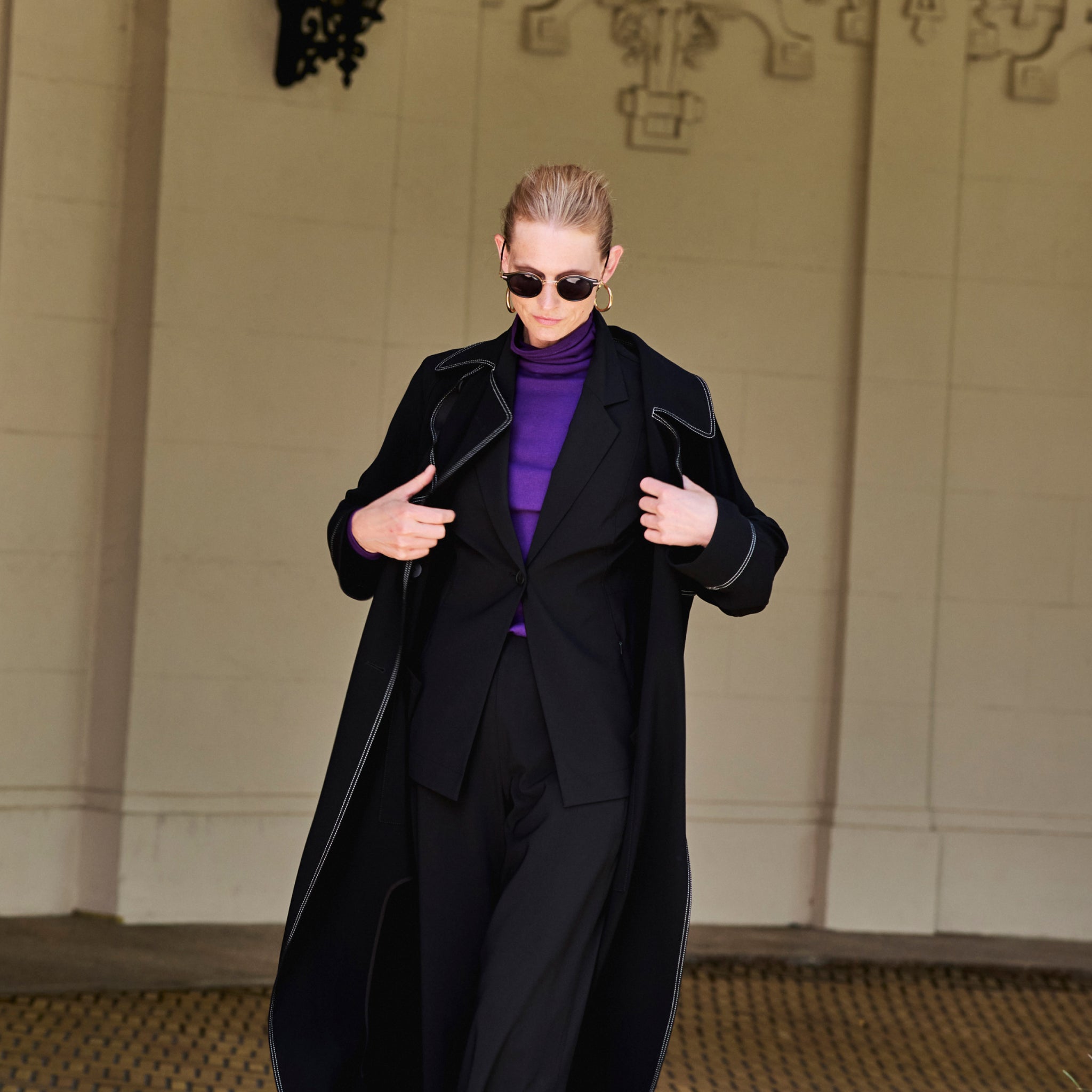 front image of a woman wearing the frankie jacket in black