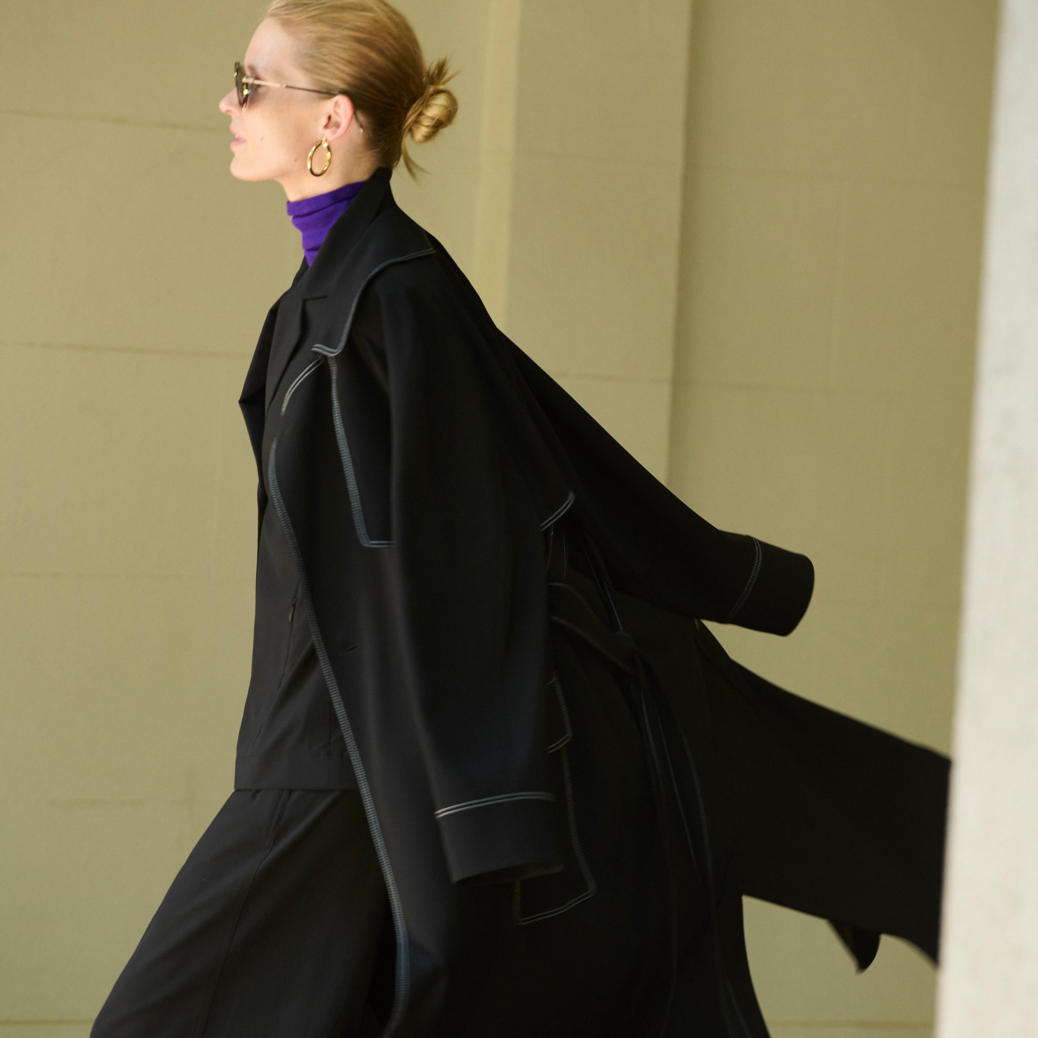 front image of a woman wearing the frankie jacket in black