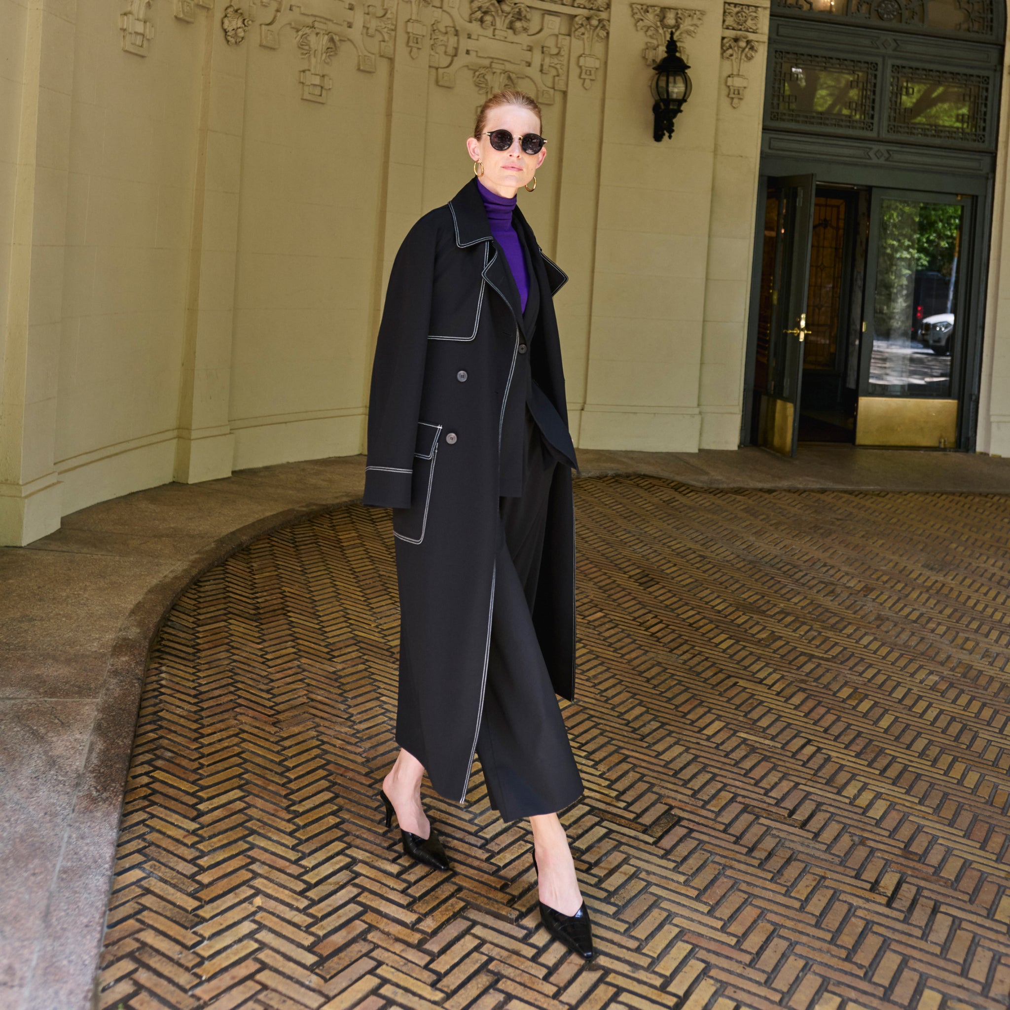front image of a woman wearing the frankie jacket in black