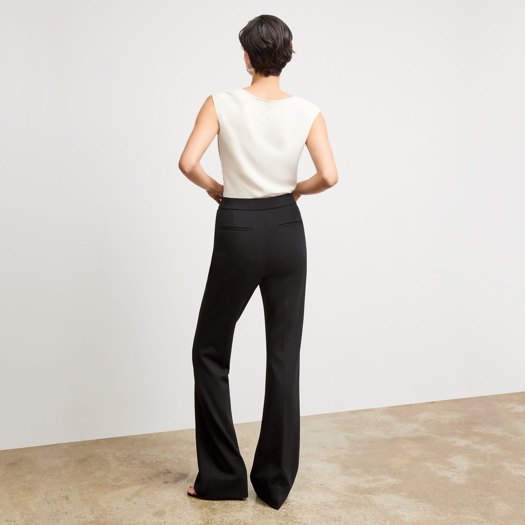 Back image of a woman wearing the hart pant in black