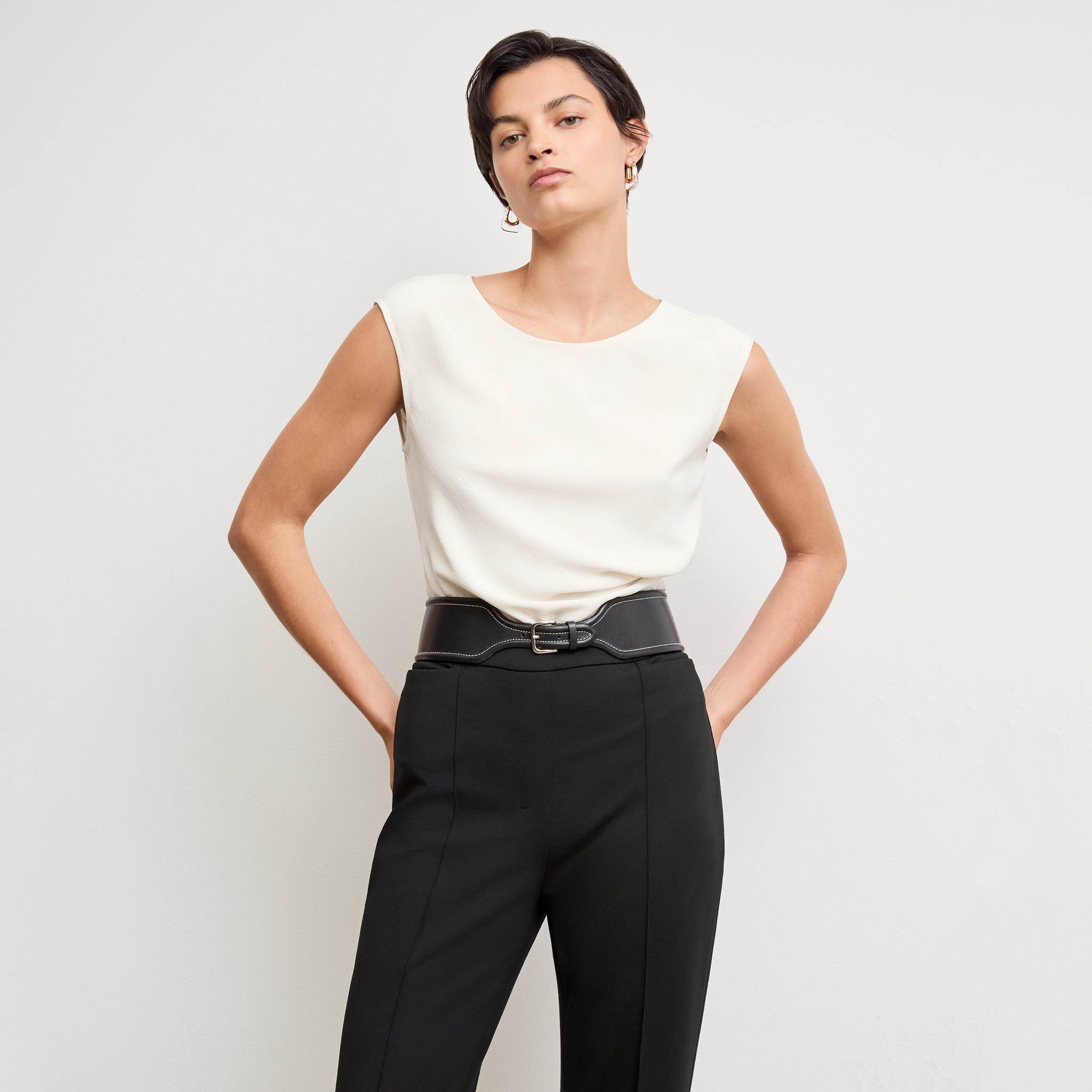 Front image of a woman wearing the hart pant in black