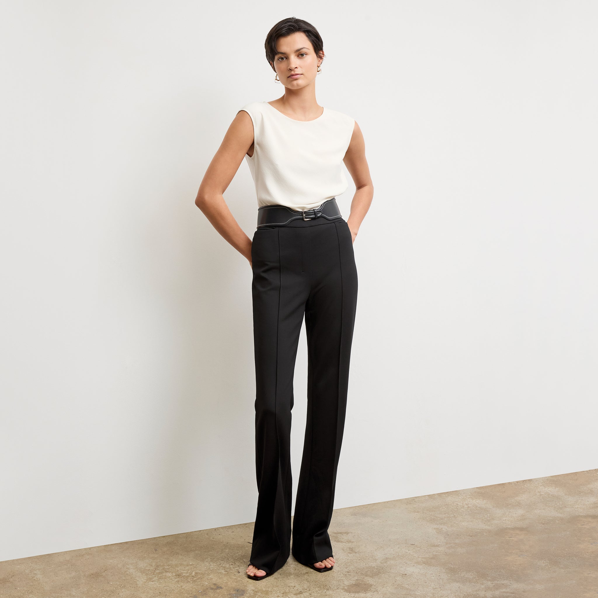 Front image of a woman wearing the hart pant in black