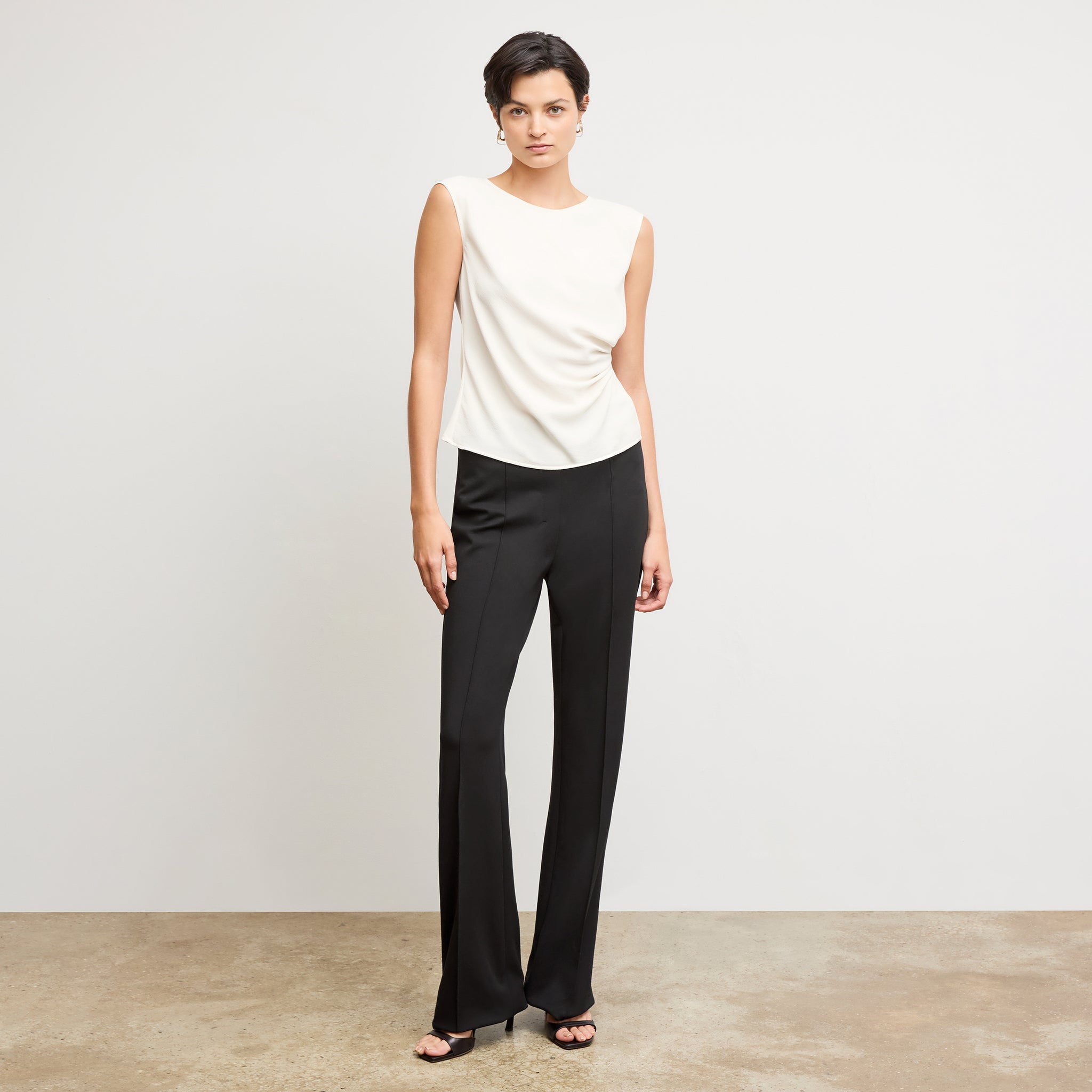 Front image of a woman wearing the hart pant in black