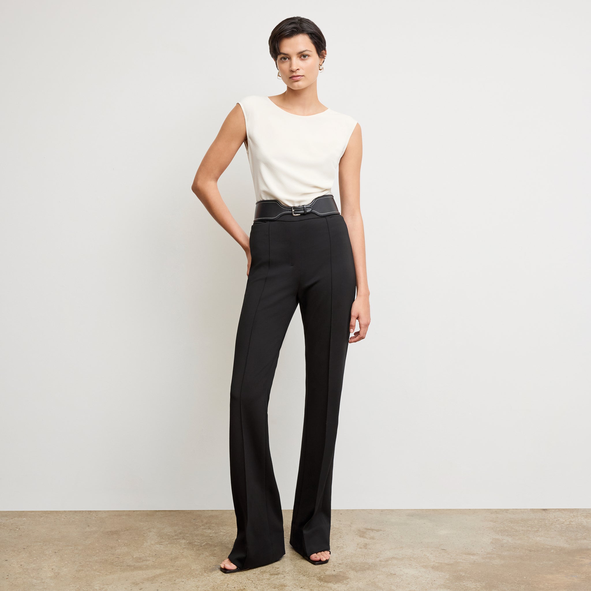 Front image of a woman wearing the hart pant in black