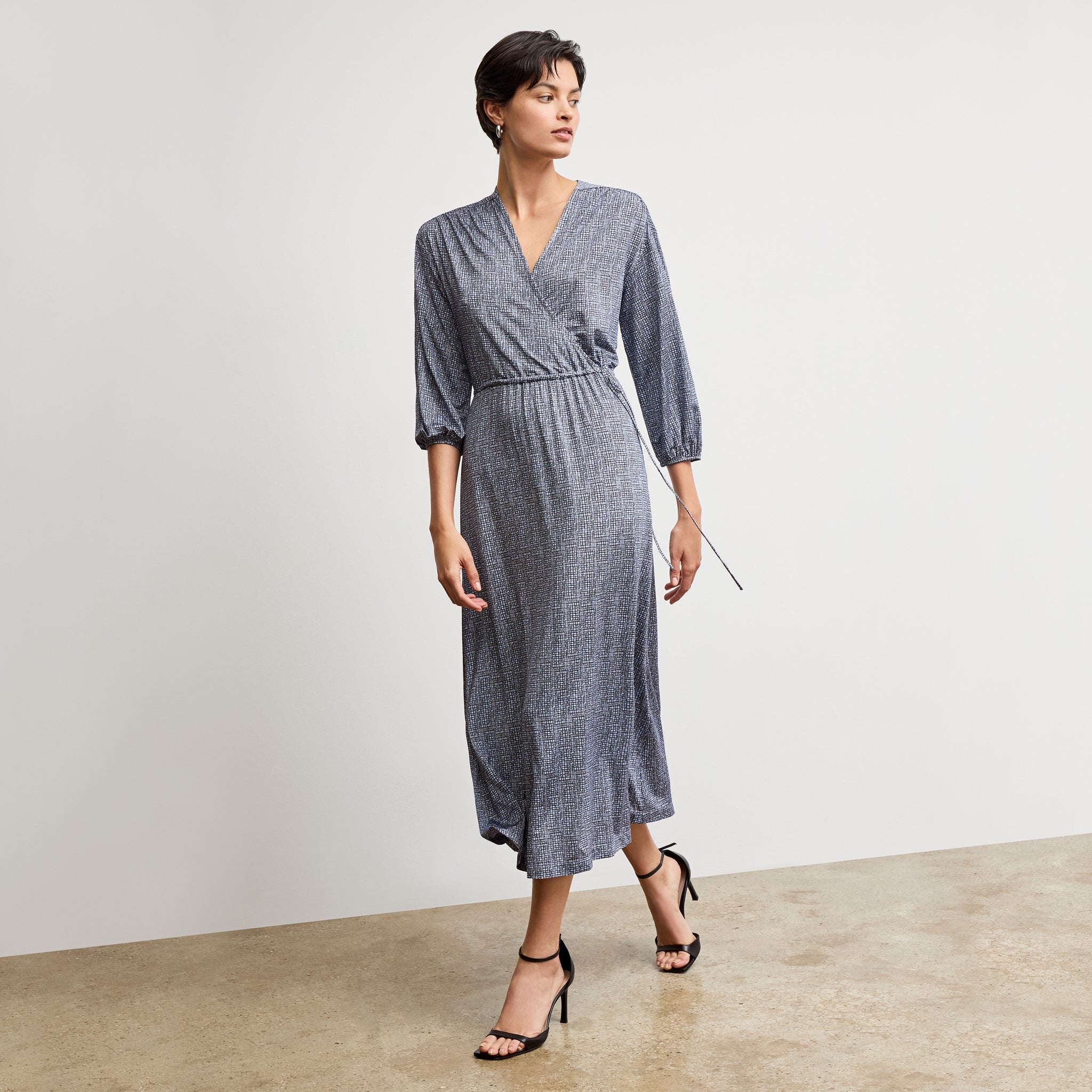 Front image of a woman wearing the hope dress in blueprint sketch 