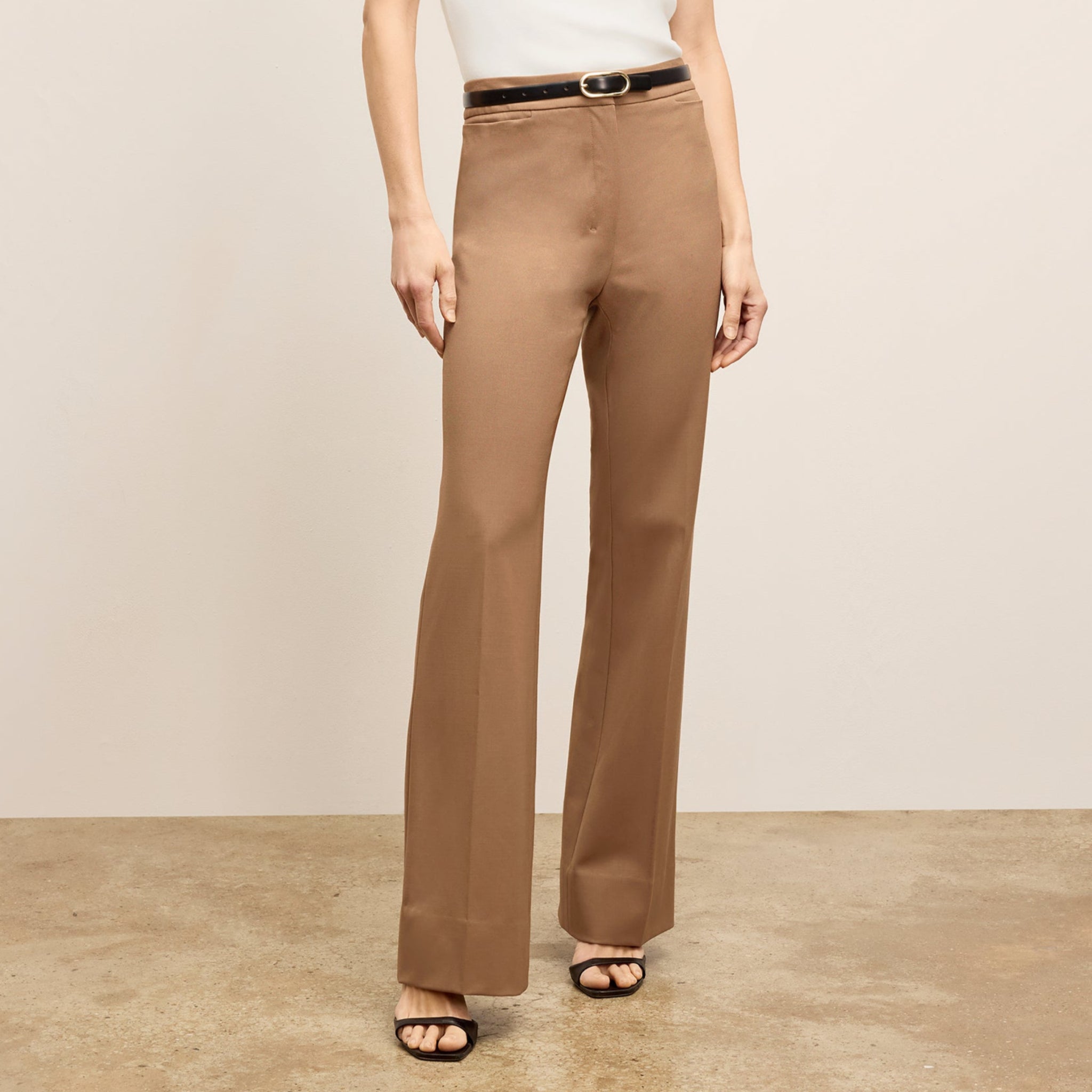 front image of a woman wearing the horton pants in saddle 