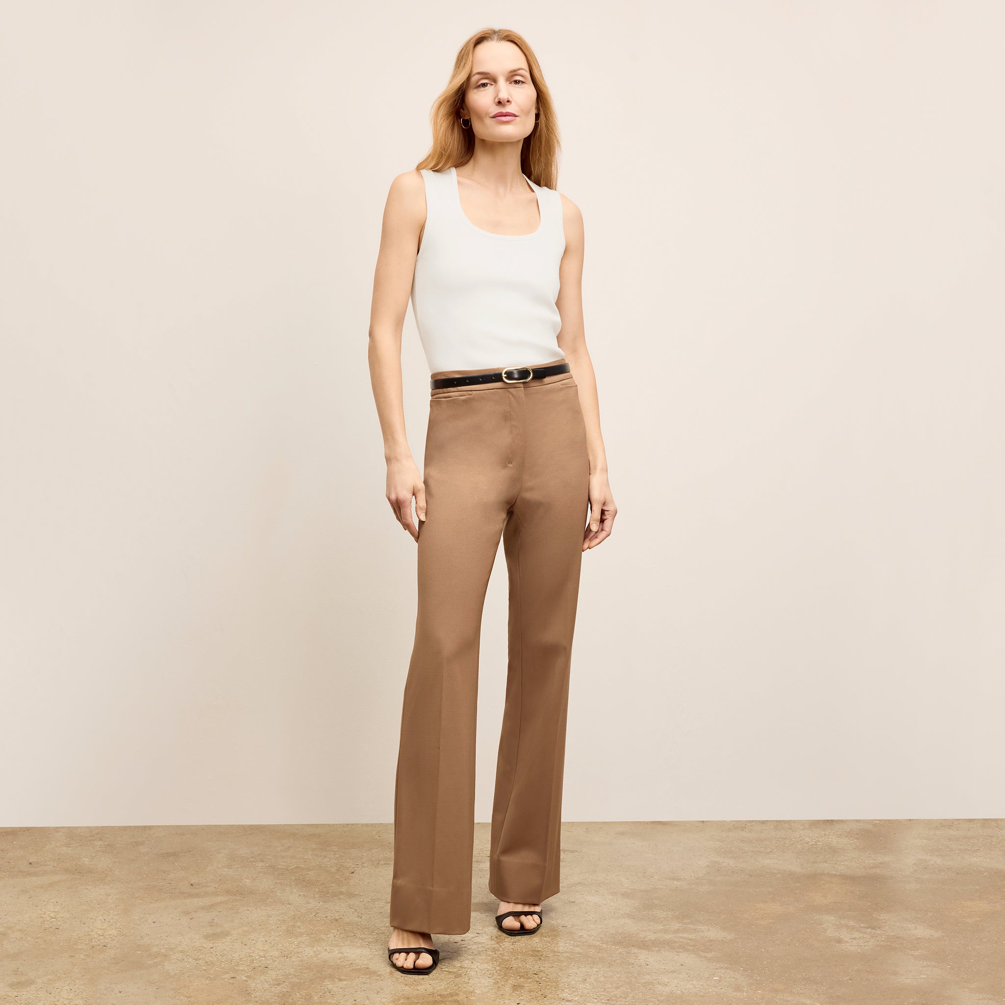 front image of a woman wearing the horton pants in saddle 