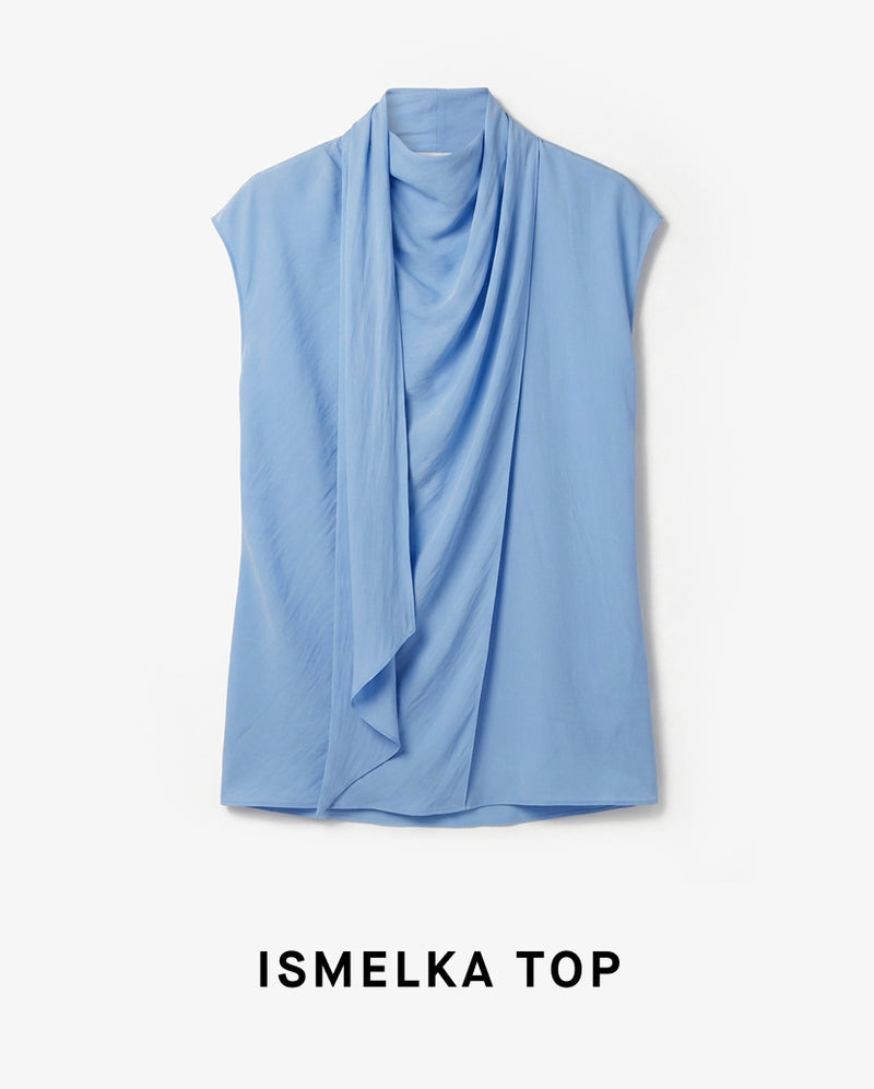 Light blue sleeveless top with draped design on a white background, labeled 'Ismelka Top'.
