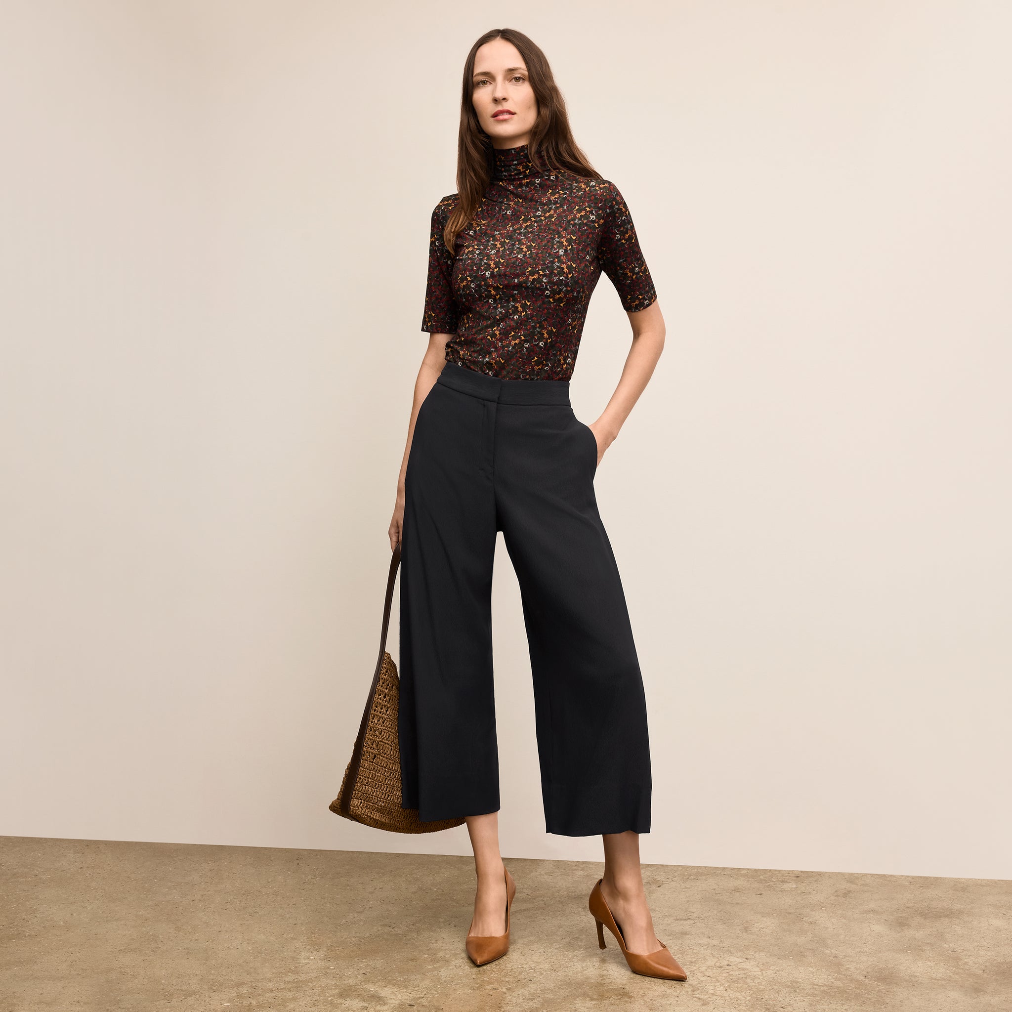 Front image of a woman standing wearing the Zhou culotte in black