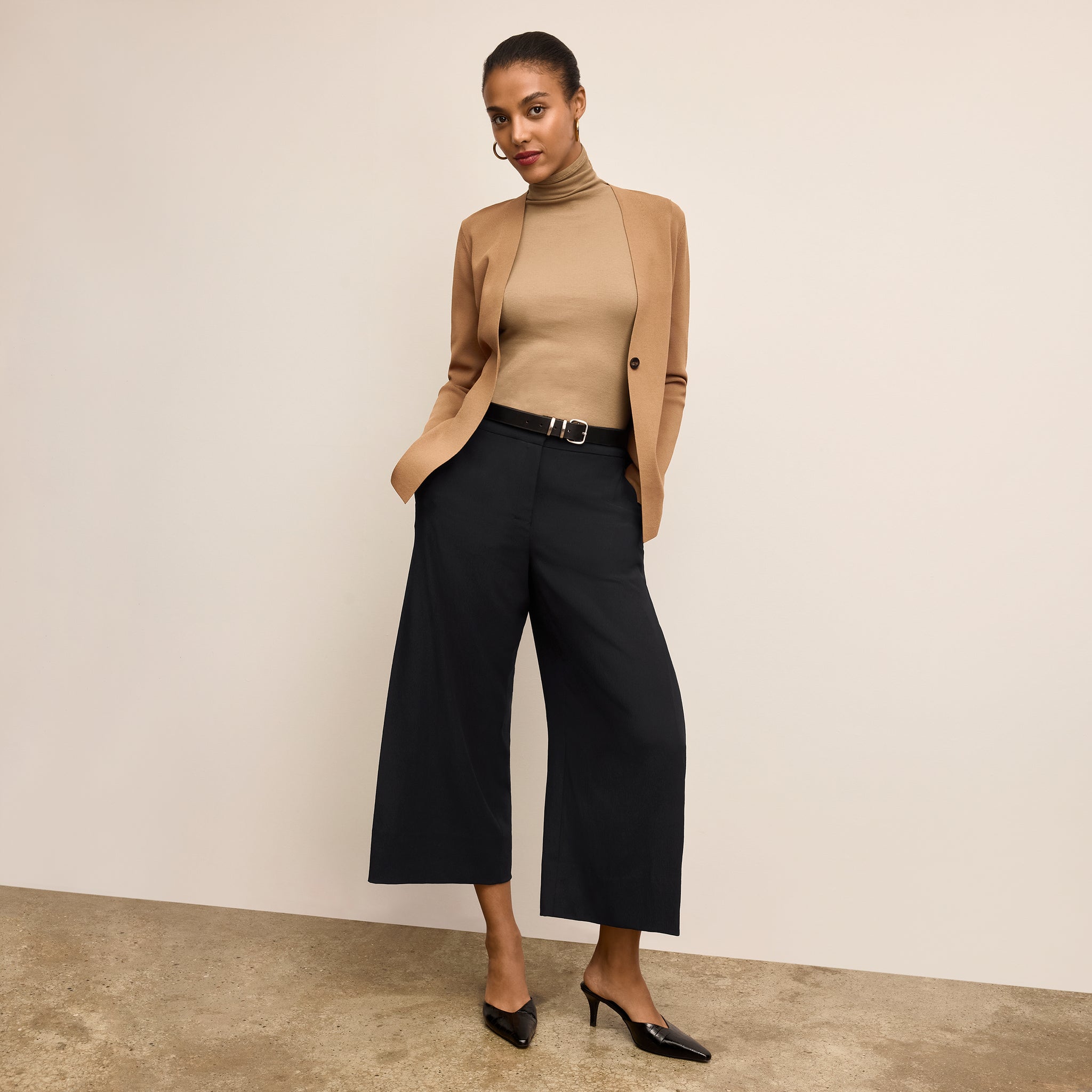 Front image of a woman standing wearing the Zhou culotte in black