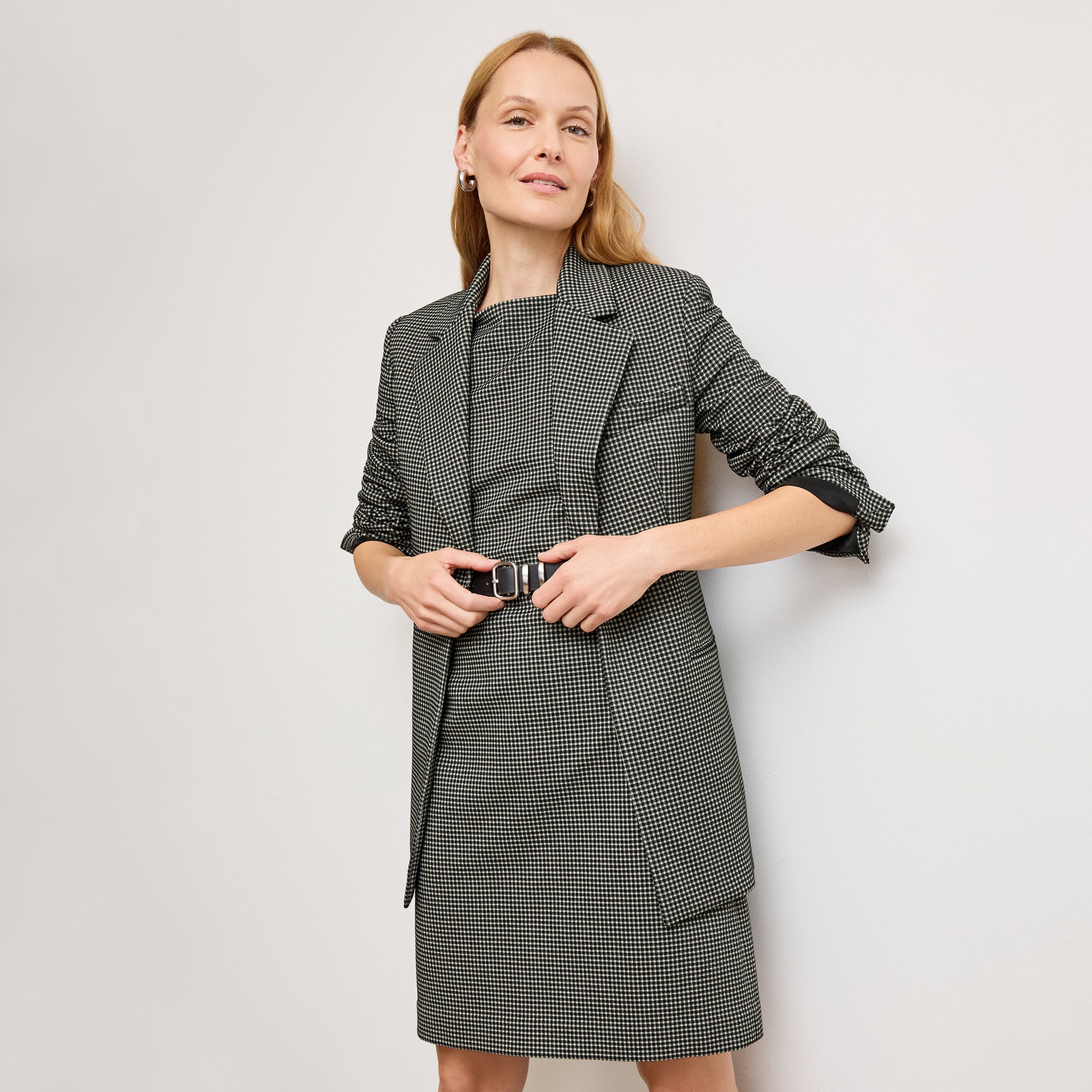 front image of a woman wearing the joanie dress in classic check