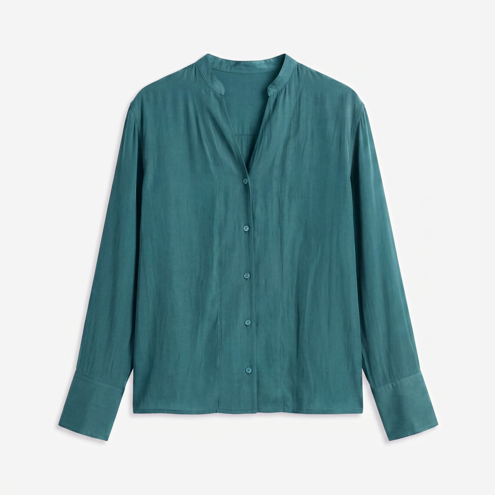 A teal long-sleeve button-up shirt with a stand collar, laid flat against a light gray background.