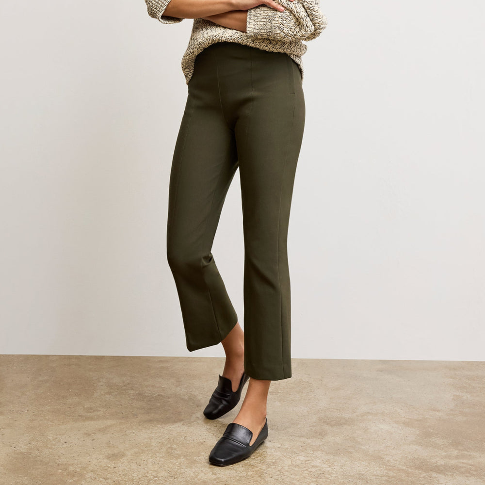 front image of a woman wearing the kick flare foster pants in olive