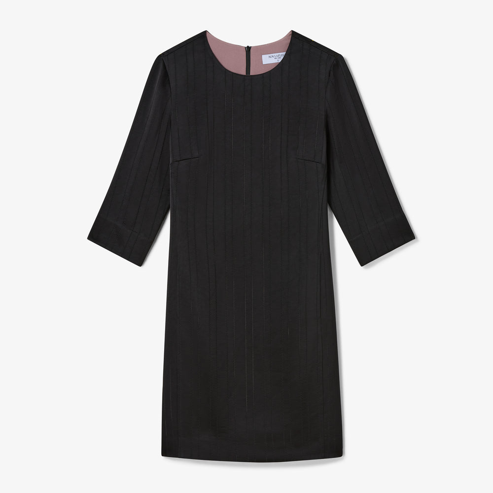 Black dress with pink lining on a white background