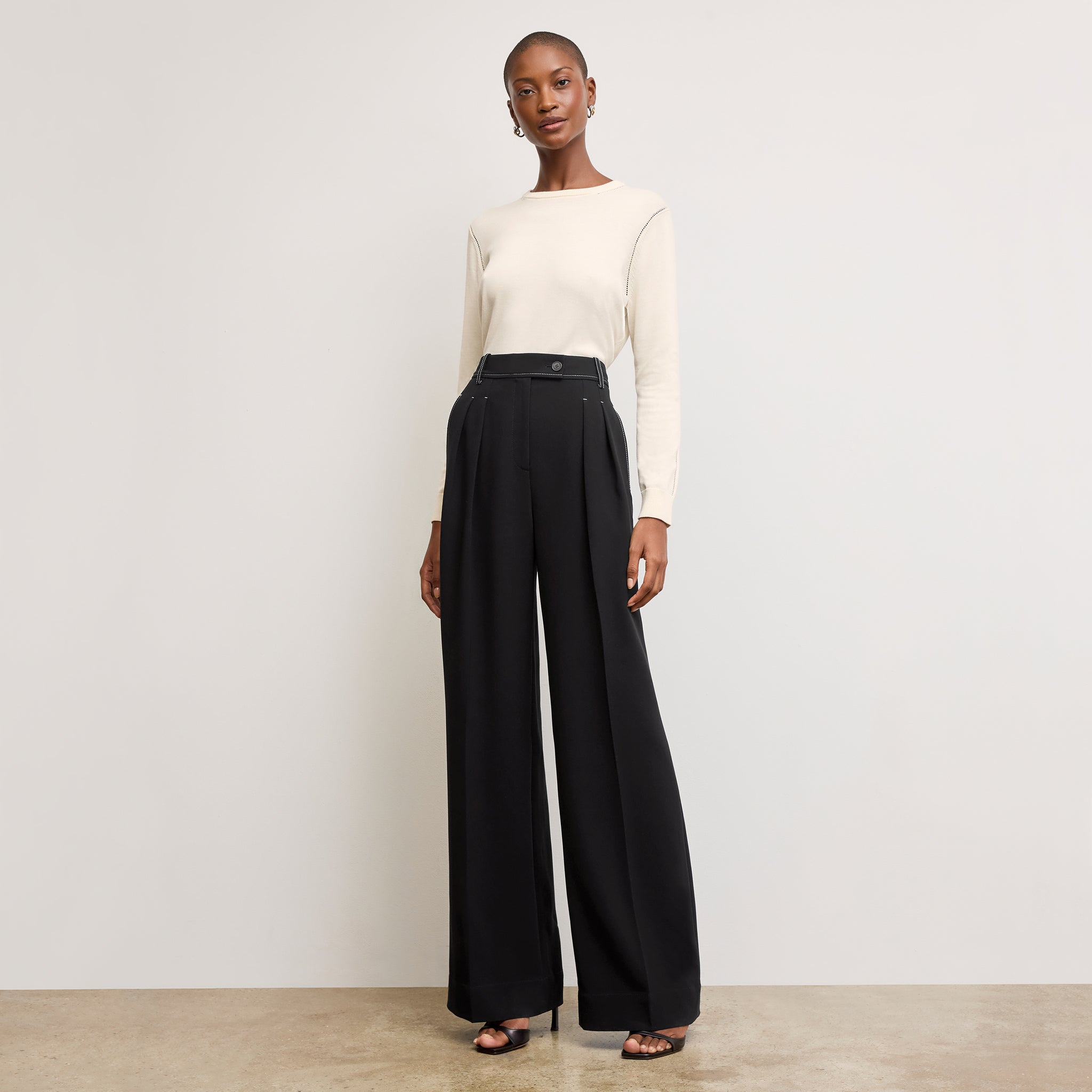 front image of a woman wearing the larissa sweater in ivory